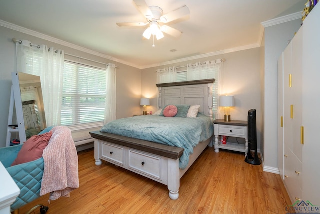 bedroom featuring ceiling fan, light hardwood / wood-style flooring, and crown molding