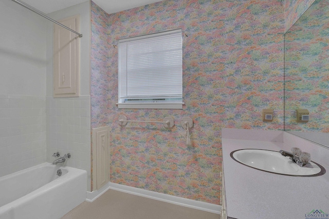 full bathroom with baseboards, shower / bath combination, vanity, and wallpapered walls