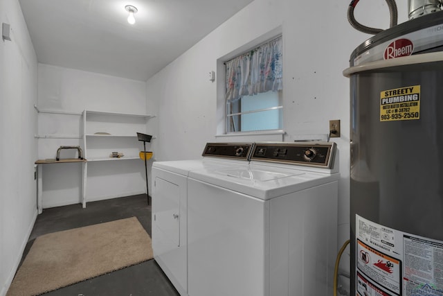 laundry room with water heater, laundry area, and washer and dryer