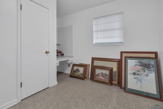 unfurnished bedroom with carpet and baseboards