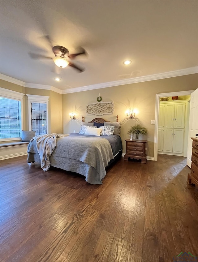 bedroom with ceiling fan, crown molding, and dark wood-type flooring