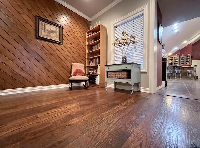 unfurnished room featuring dark wood-type flooring, crown molding, bar, lofted ceiling, and wood walls