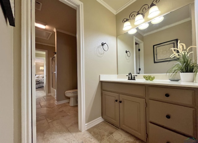 bathroom featuring vanity, toilet, and ornamental molding