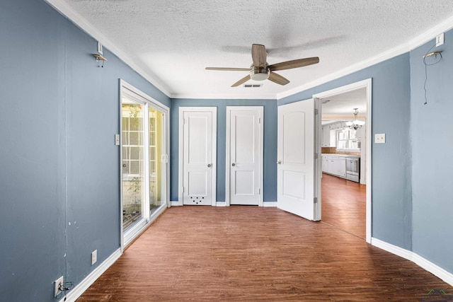 interior space with access to exterior, ornamental molding, ceiling fan with notable chandelier, a textured ceiling, and wood-type flooring