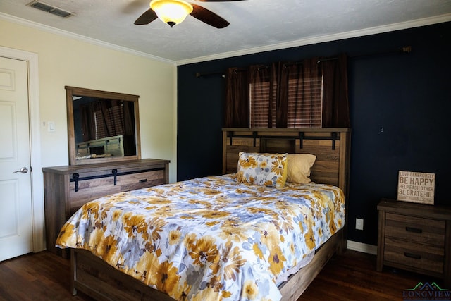 bedroom featuring ceiling fan, dark hardwood / wood-style flooring, a textured ceiling, and ornamental molding