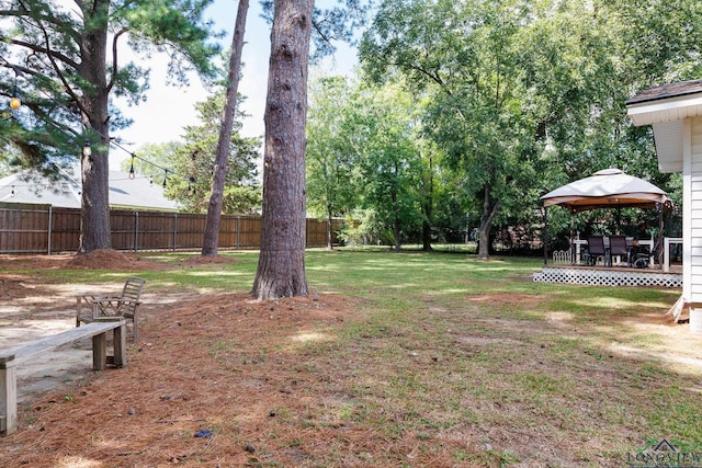 view of yard with a gazebo and a wooden deck