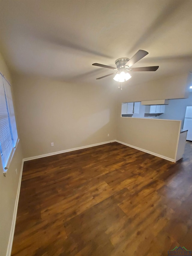 unfurnished room with dark hardwood / wood-style floors and ceiling fan