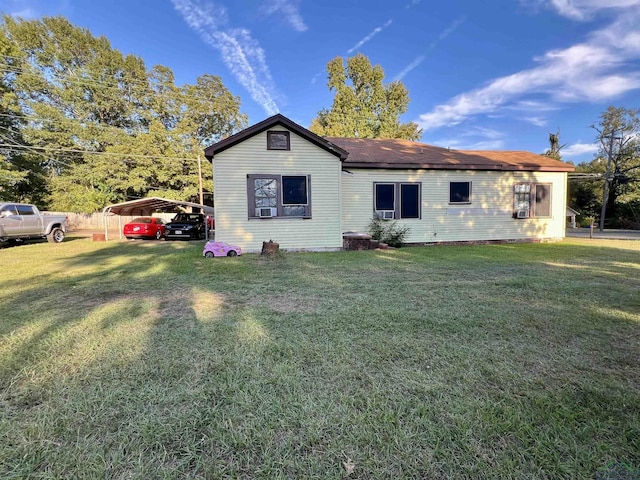 view of property exterior featuring a lawn and a carport