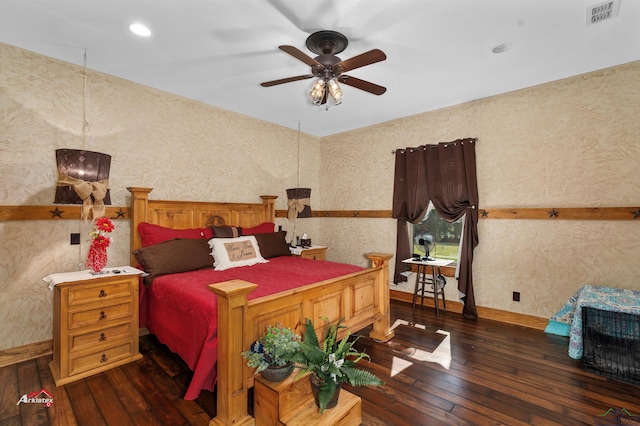 bedroom with ceiling fan and dark hardwood / wood-style flooring