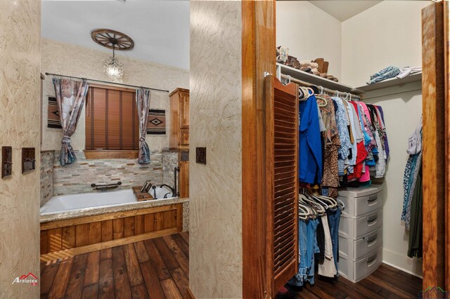 bathroom featuring a washtub and hardwood / wood-style floors