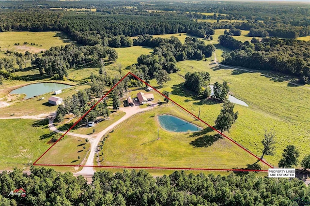 birds eye view of property featuring a rural view and a water view