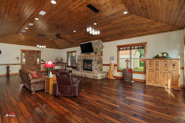 living room featuring ceiling fan, a fireplace, wood ceiling, and dark hardwood / wood-style floors