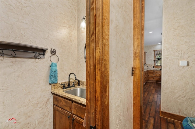 bathroom with vanity and wood-type flooring