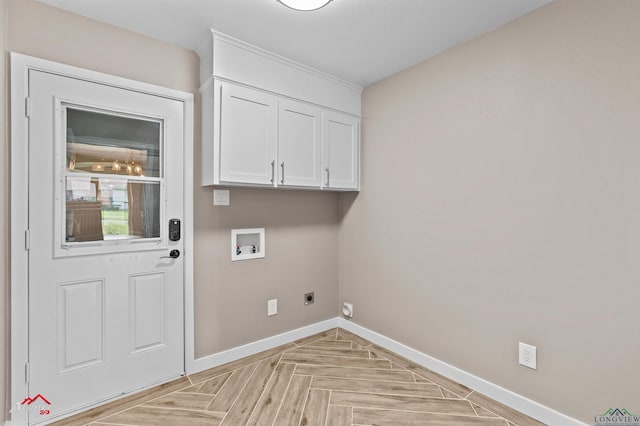 404 Pinewood, Marshall, TX 75672 - laundry room with washer hookup, electric dryer hookup, and cabinet space