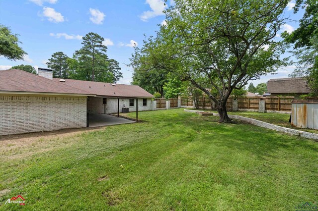 404 Pinewood, Marshall, TX 75672 - fenced backyard featuring a patio area