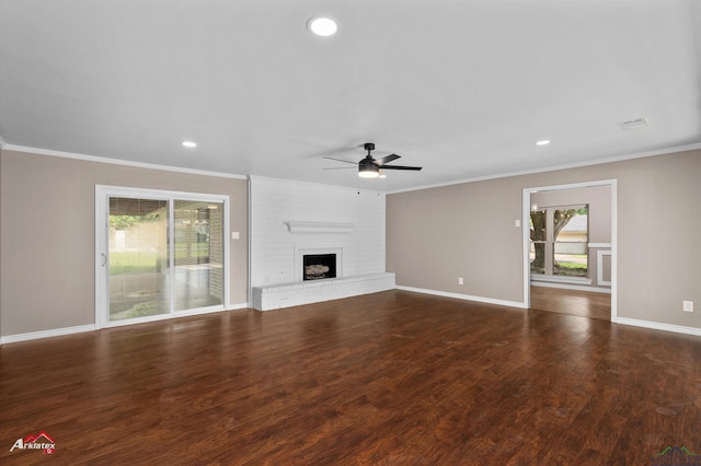 404 Pinewood, Marshall, TX 75672 - unfurnished living room featuring ornamental molding, ceiling fan, healthy amount of natural light, a brick fireplace, and recessed lighting