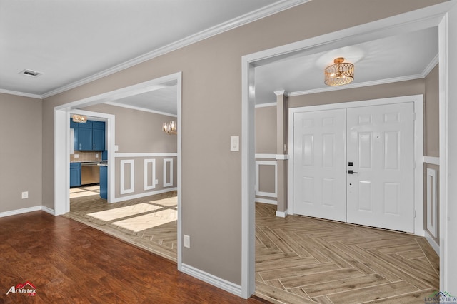 404 Pinewood, Marshall, TX 75672 - foyer entrance featuring a chandelier, ornamental molding, and parquet flooring