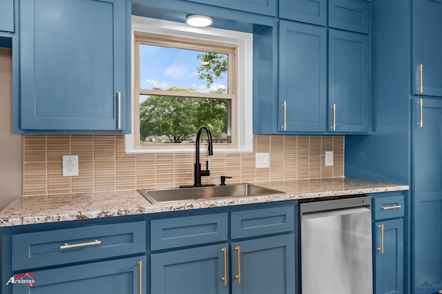 404 Pinewood, Marshall, TX 75672 - kitchen featuring stainless steel dishwasher, blue cabinets, and tasteful backsplash