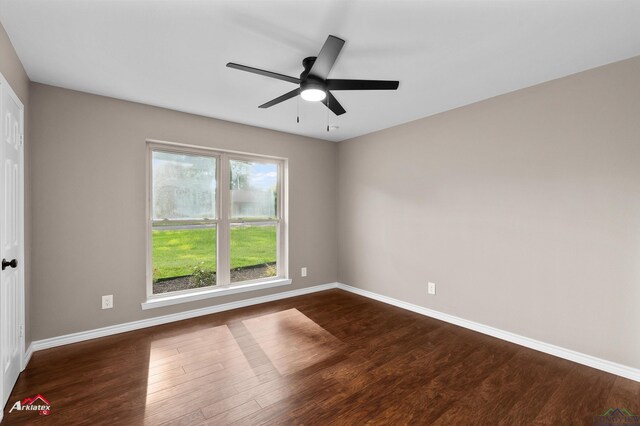 404 Pinewood, Marshall, TX 75672 - empty room featuring dark wood finished floors and a ceiling fan