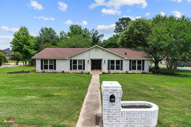 404 Pinewood, Marshall, TX 75672 - view of front facade with brick siding and a front lawn