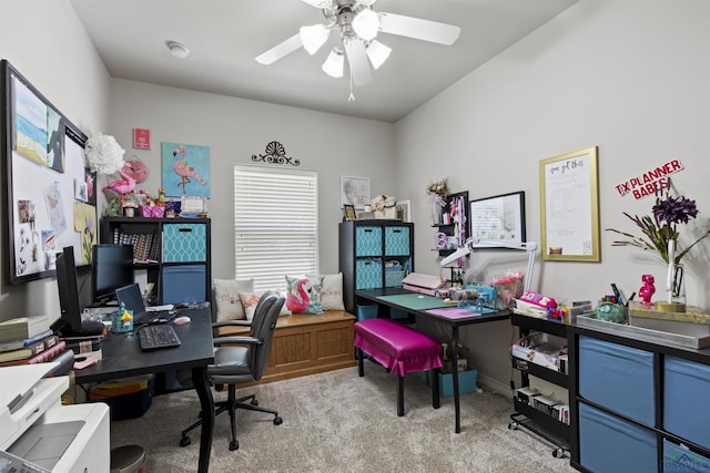 office space featuring ceiling fan and light colored carpet