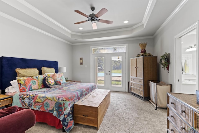 carpeted bedroom featuring connected bathroom, ceiling fan, french doors, a raised ceiling, and access to outside