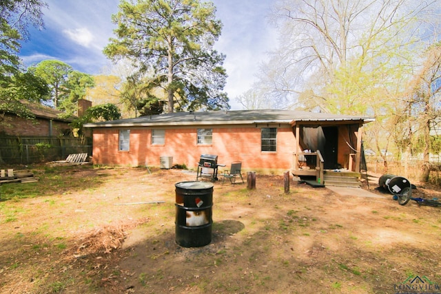 back of house featuring fence