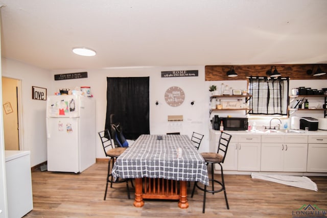 dining area with light wood-type flooring