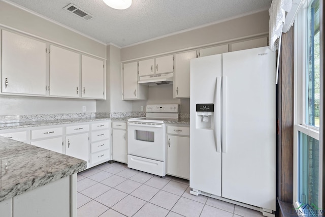 kitchen featuring white appliances, visible vents, a textured ceiling, under cabinet range hood, and light tile patterned flooring