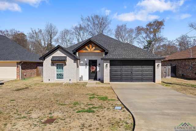 view of front of house with a garage, driveway, brick siding, and roof with shingles