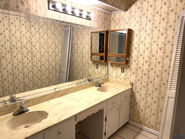 bathroom featuring tile patterned flooring and vanity