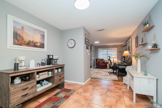 hallway featuring light tile patterned floors