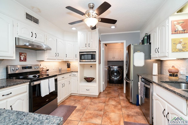 kitchen featuring white cabinets, appliances with stainless steel finishes, backsplash, and washer / clothes dryer