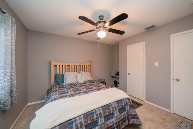 carpeted bedroom with ceiling fan