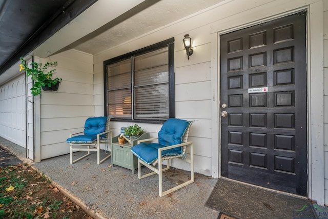 doorway to property featuring a porch