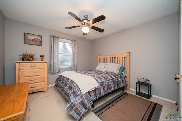 bedroom featuring ceiling fan and light colored carpet