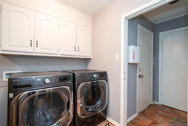 clothes washing area featuring cabinets, independent washer and dryer, a textured ceiling, and light tile patterned floors