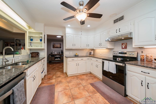 kitchen featuring dark stone countertops, white cabinetry, sink, and appliances with stainless steel finishes