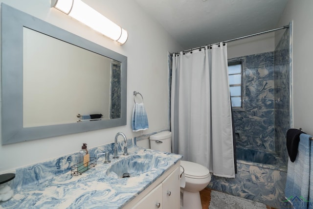 full bathroom with vanity, shower / bath combination with curtain, and toilet