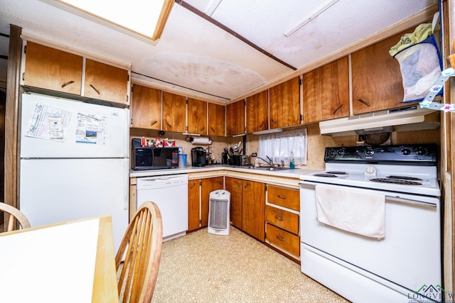 kitchen with white appliances and sink