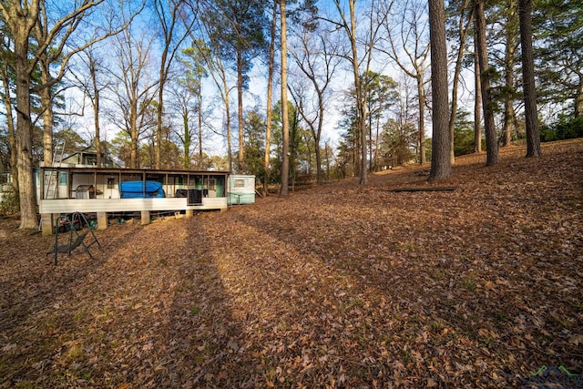 view of yard featuring a wooden deck