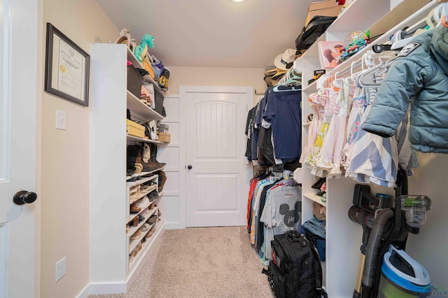 spacious closet featuring carpet floors
