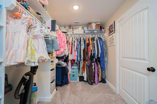 spacious closet featuring carpet floors