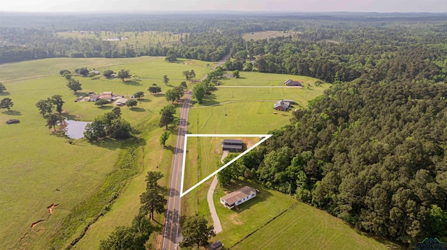 overview of rural landscape featuring a heavily wooded area and property parcel outlined