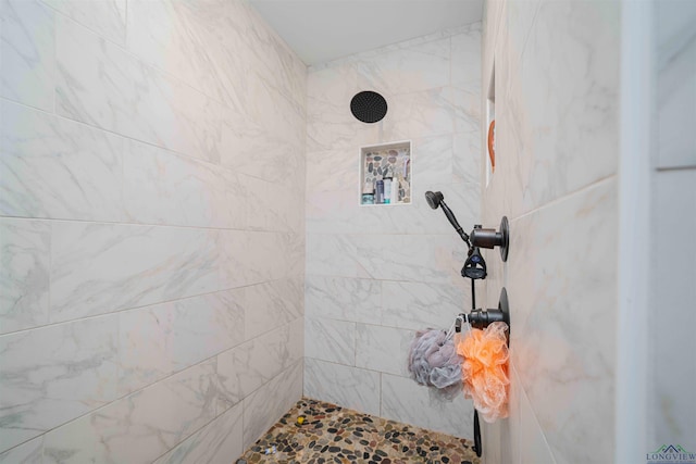 full bathroom featuring tiled shower