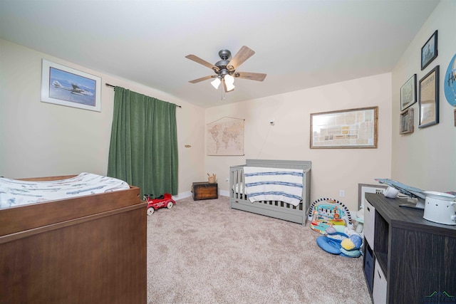 carpeted bedroom with baseboards and ceiling fan