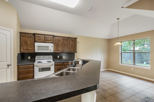 kitchen featuring lofted ceiling, sink, dark brown cabinets, white appliances, and decorative backsplash