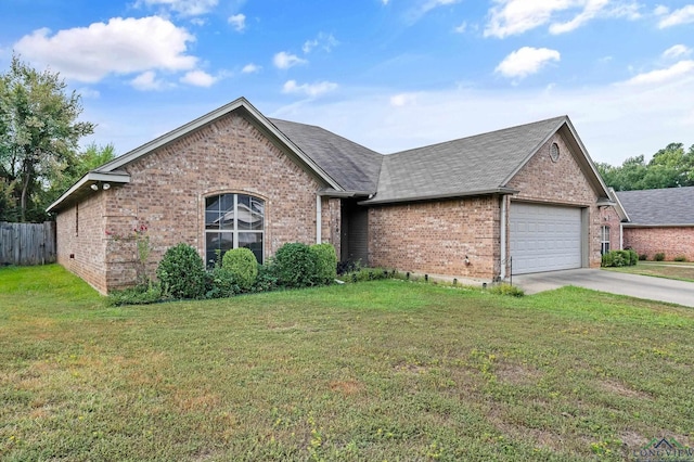 view of front of home with a garage and a front yard