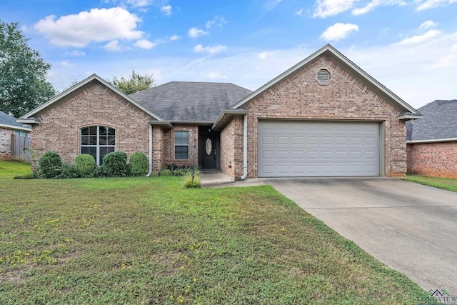 view of front of home with a garage and a front lawn