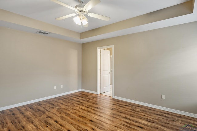 unfurnished room featuring hardwood / wood-style floors and ceiling fan